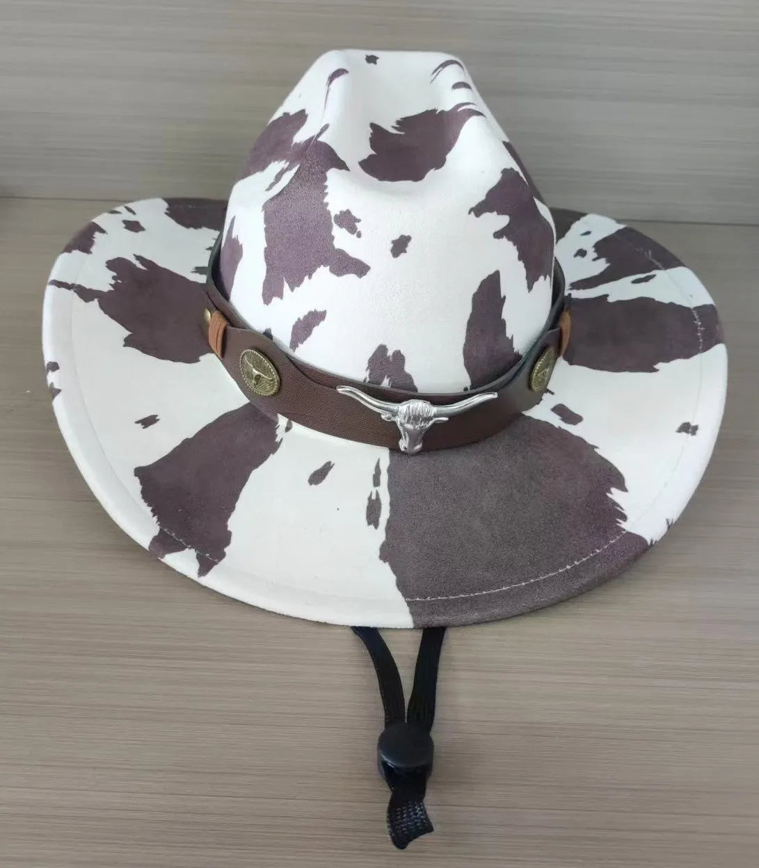 Brown leather velvet cowboy hat with curved brim and conical crown.