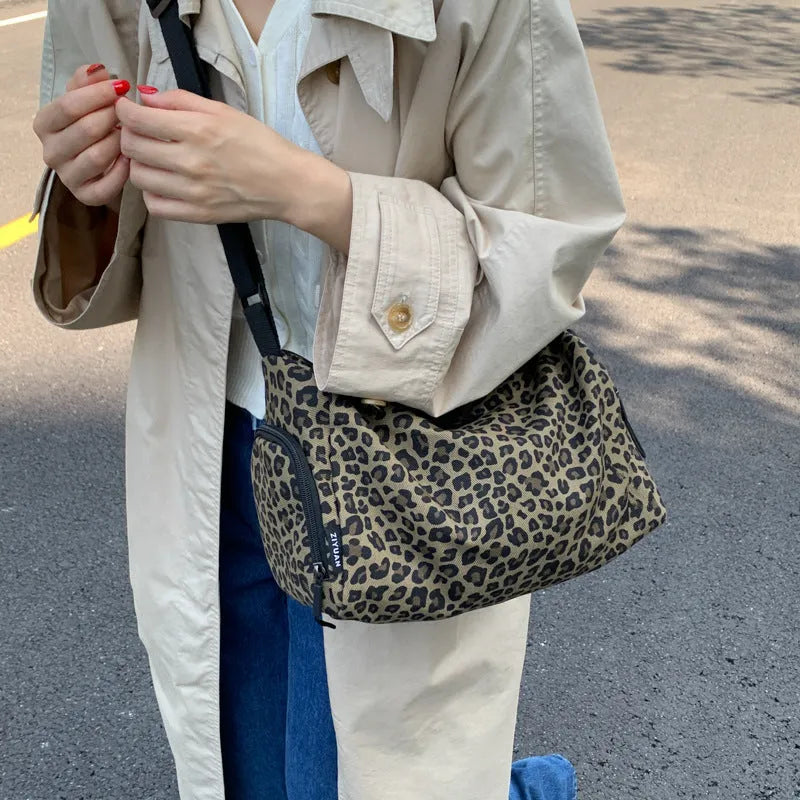 Large capacity leopard print sports messenger bag with cross-body strap and stitching details