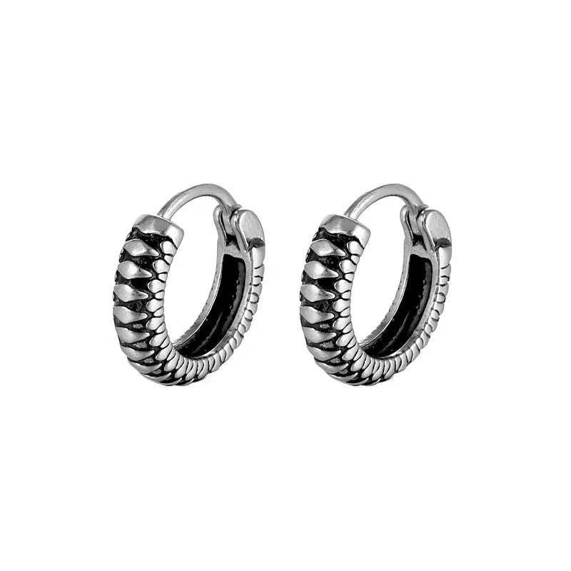 Silver geometric stainless steel earrings with a twist and striped design on a white background.