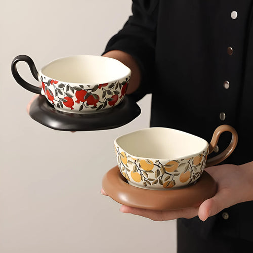 Antique style ceramic coffee cup and saucer set with medieval pattern in black or orange