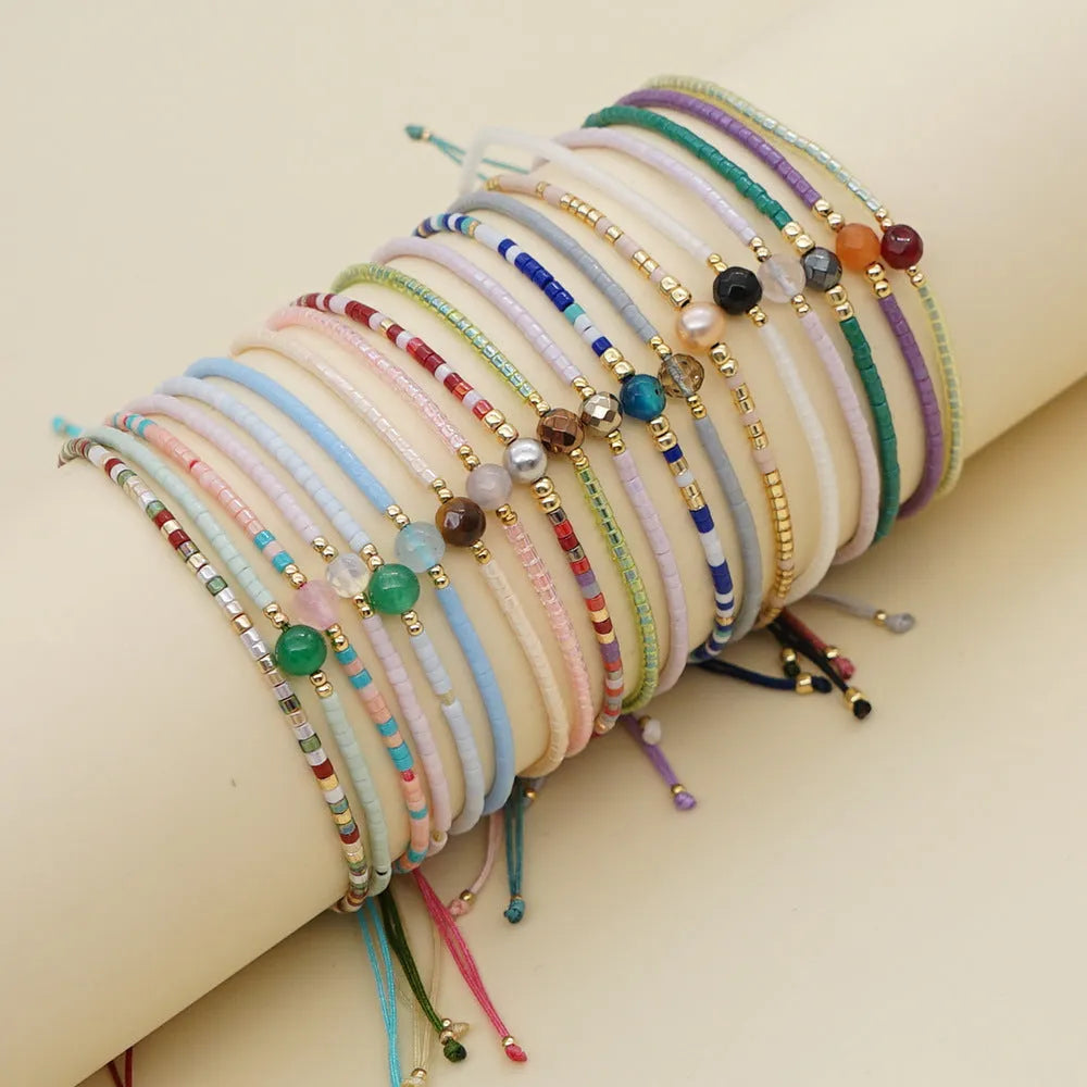 Women's handmade bohemian bracelet with semi-precious stone bead and colourful glass beads.