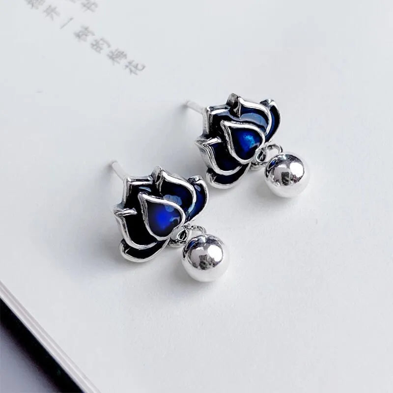 Blue lotus ear studs with lotus seedpod tassel design measuring 1.2cm width