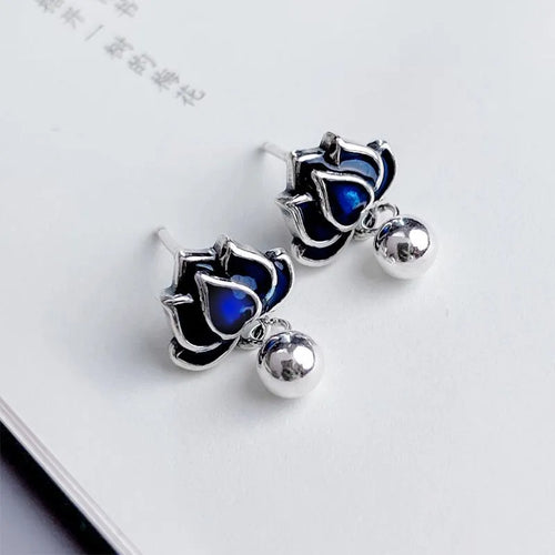 Blue lotus ear studs with lotus seedpod tassel design measuring 1.2cm width