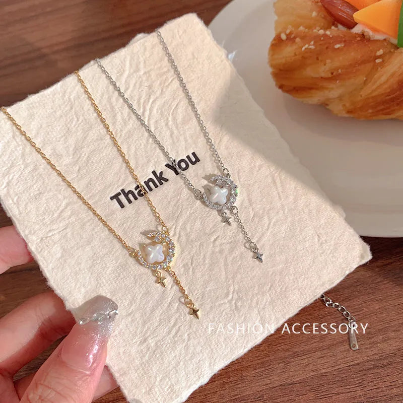 Women's star moon necklace with zirconium accents on adjustable chain in gold or silver finish