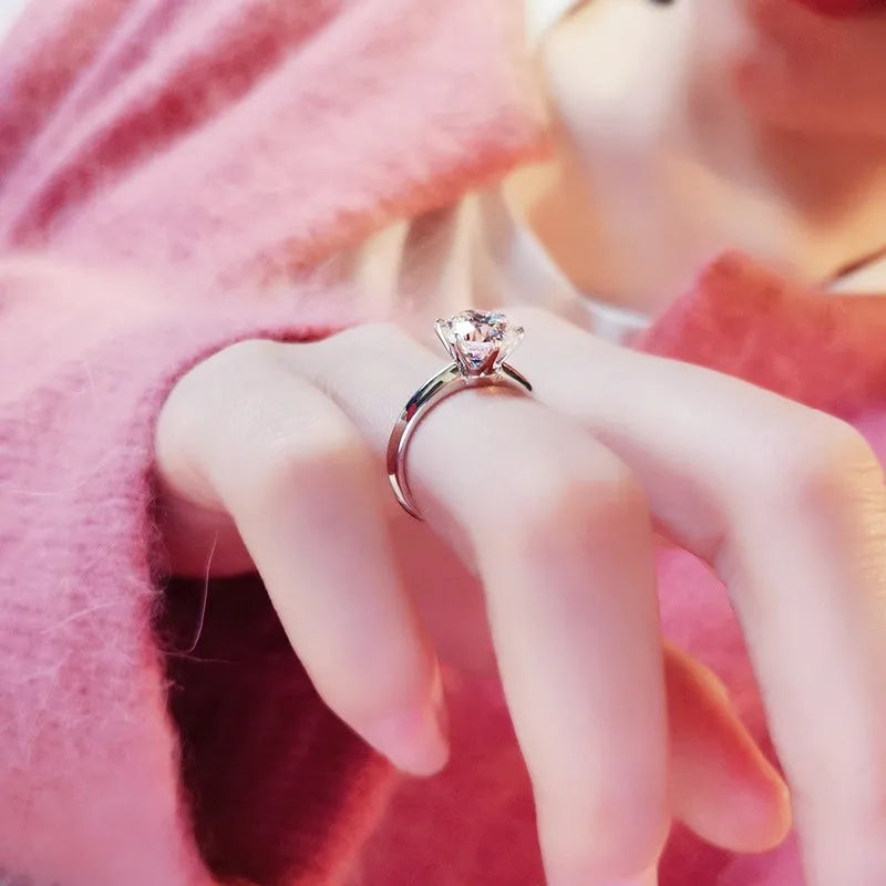 White gold plated women's ring with a geometric zircon stone in a six-claw setting.
