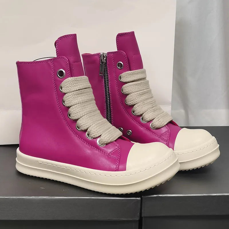 Black high-top leather sneakers with side zipper on a white background.
