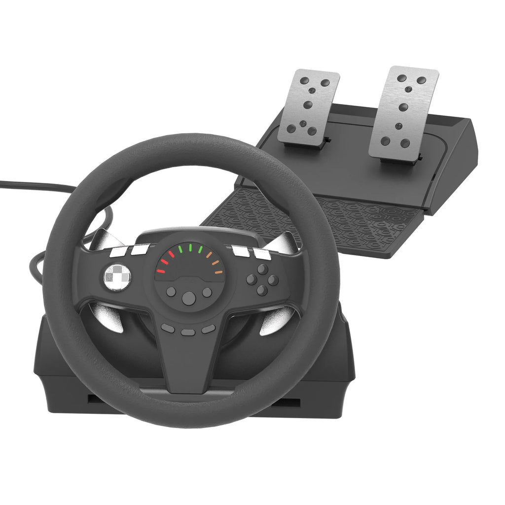 Black multi-platform gaming steering wheel with two pedals and a USB cable on a desk.