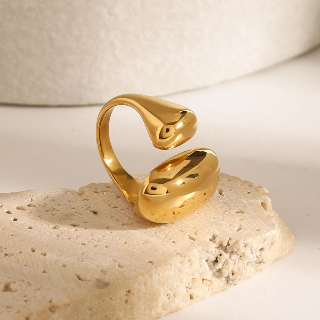 Women's exaggerated geometric stainless steel open ring with electroplated finish.