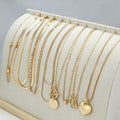 Gold electroplated women's necklace set with 10 pieces featuring snake bone chains and alloy pendants