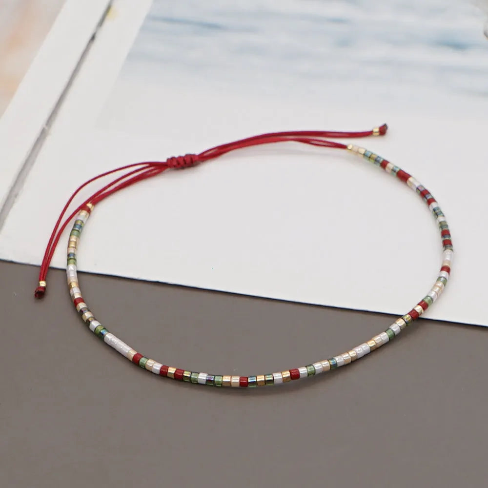 Women's handmade bohemian bracelet with semi-precious stone bead and colourful glass beads.