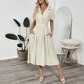 Light green women's lapel collar shirt dress with waist-tight skirt and pockets