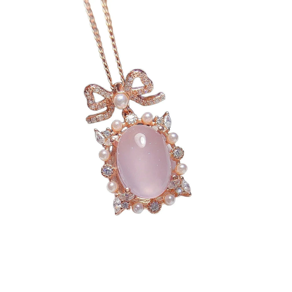 Geometric pink rose quartz pendant on silver necklace with rose gold plating