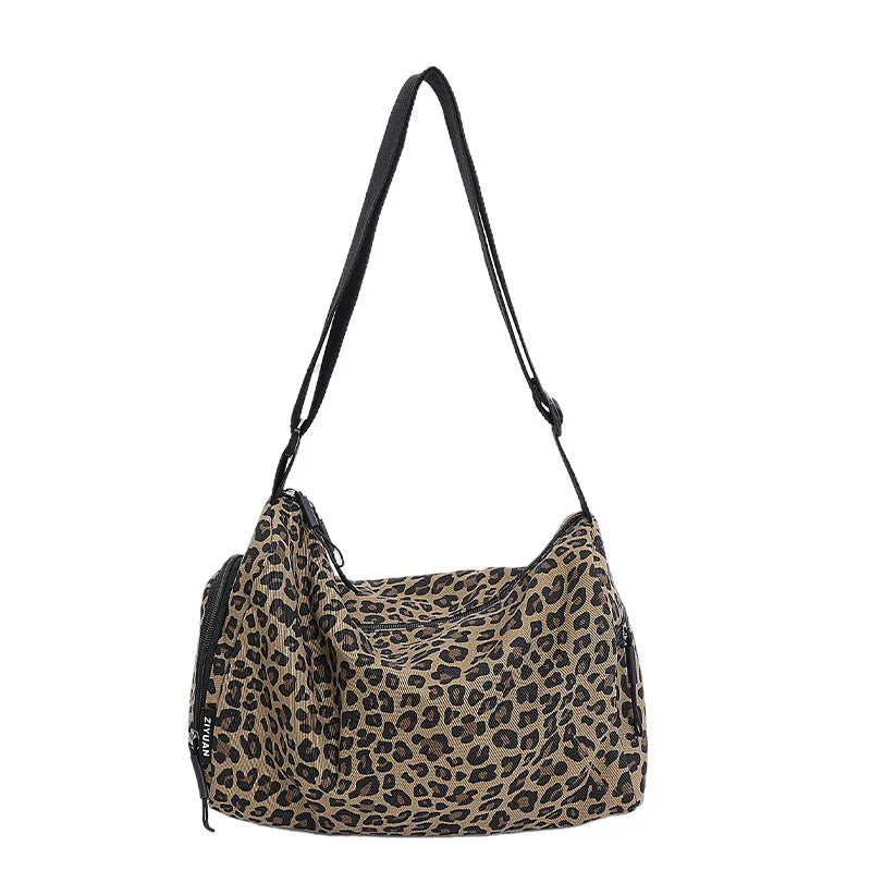 Large capacity leopard print sports messenger bag with cross-body strap and stitching details