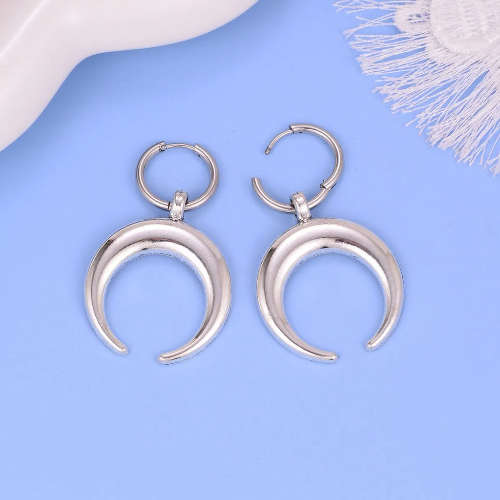 Silver geometric big hoop earrings with a gothic moon charm and clip-on fastening