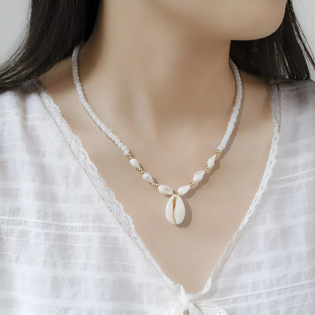 White conch shell bead necklace with a real mother-of-pearl pendant on a regular chain.