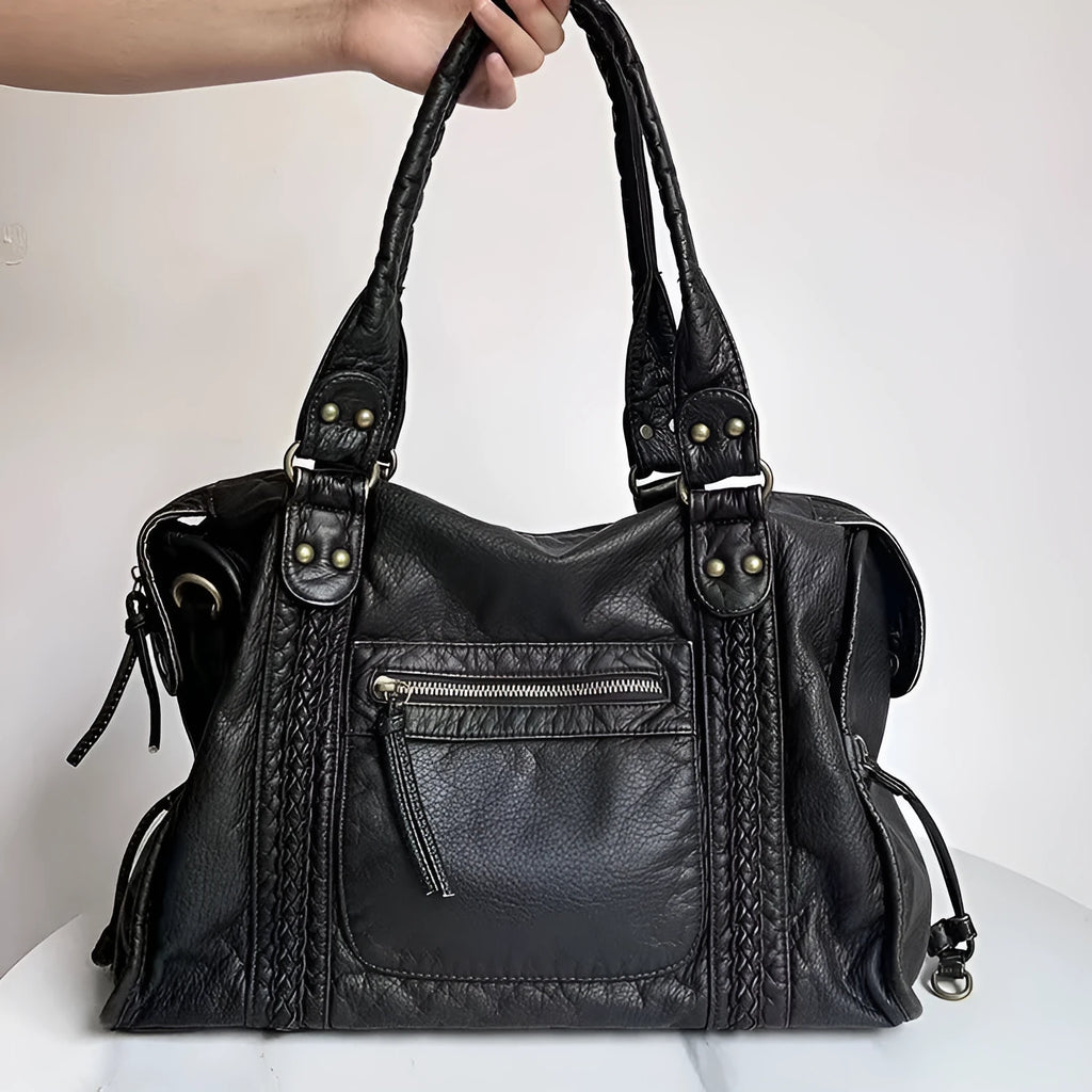 Women's retro motorcycle messenger shoulder bag with woven detail showing organised interior compartments