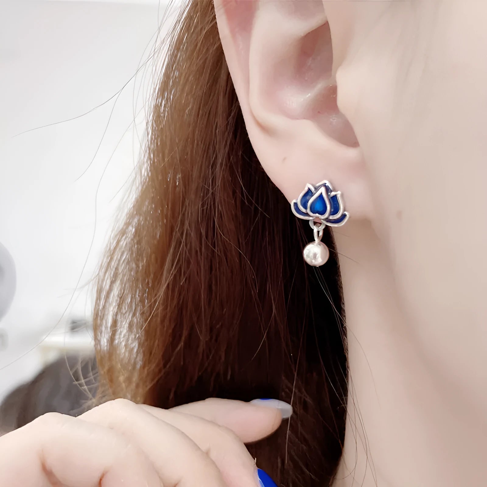 Blue lotus ear studs with lotus seedpod tassel design measuring 1.2cm width