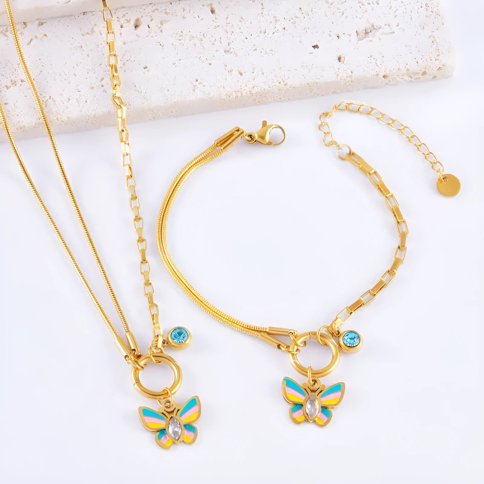 Gold titanium steel butterfly jewellery set with colourful epoxy pendant on snake bones chain necklace and bracelet
