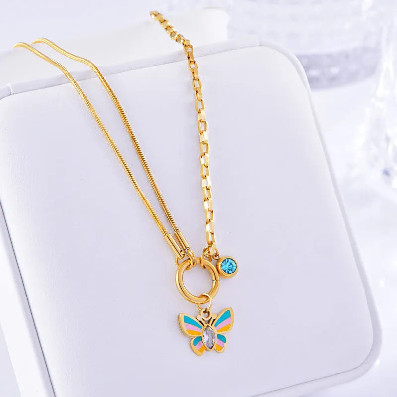 Gold titanium steel butterfly jewellery set with colourful epoxy pendant on snake bones chain necklace and bracelet