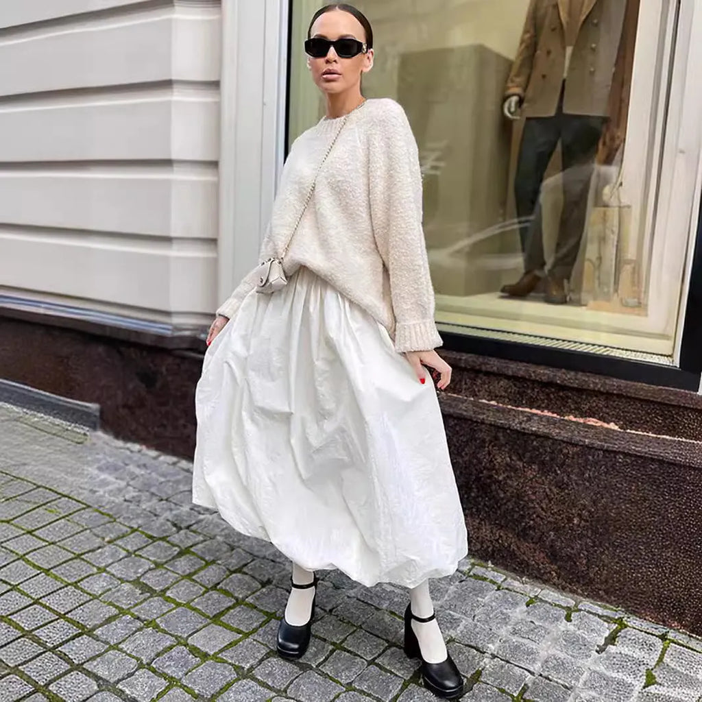 Women's long solid colour cotton skirt on a hanger, showing elasticated waist.