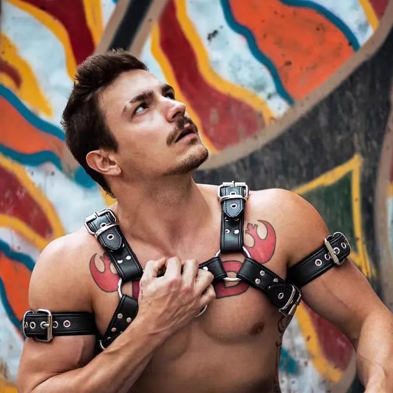 Black leather chest muscle bondage strap with metal buckle and rivets on a mannequin
