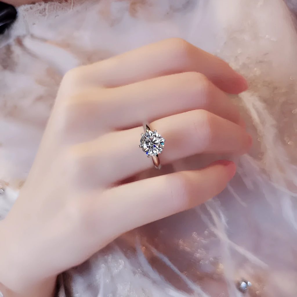 White gold plated women's ring with a geometric zircon stone in a six-claw setting.