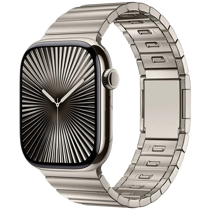Silver stainless steel magnetic buckle strap for an Apple Watch on a wrist
