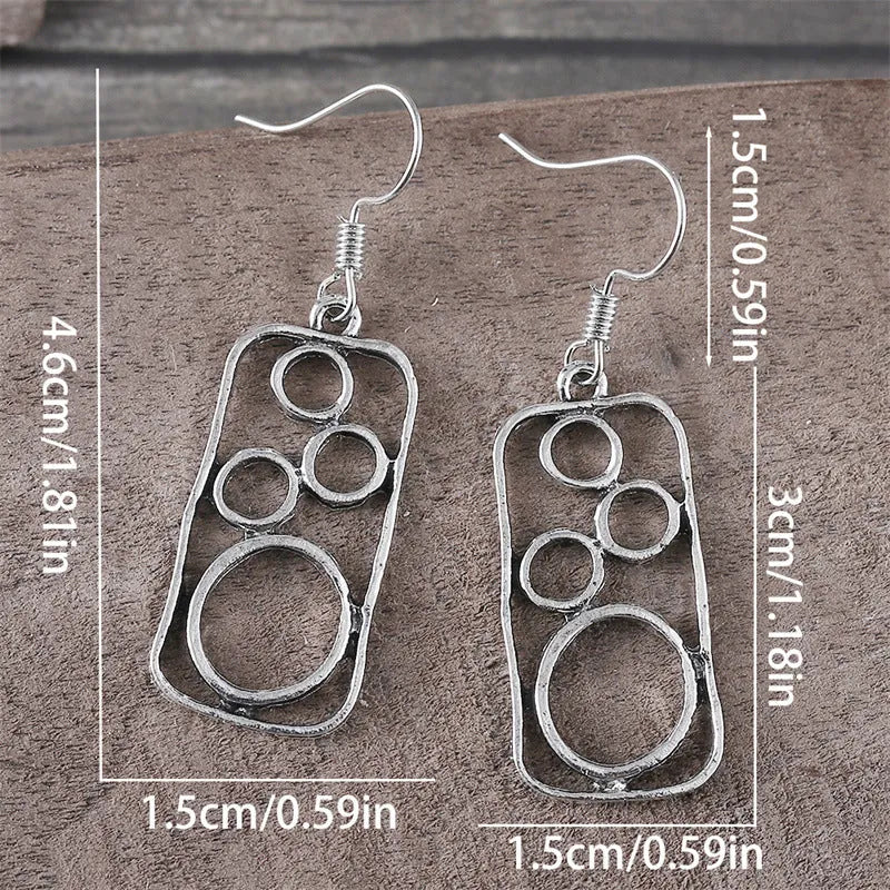 Geometric alloy earrings with round ring design and irregular square shape in antique silver colour