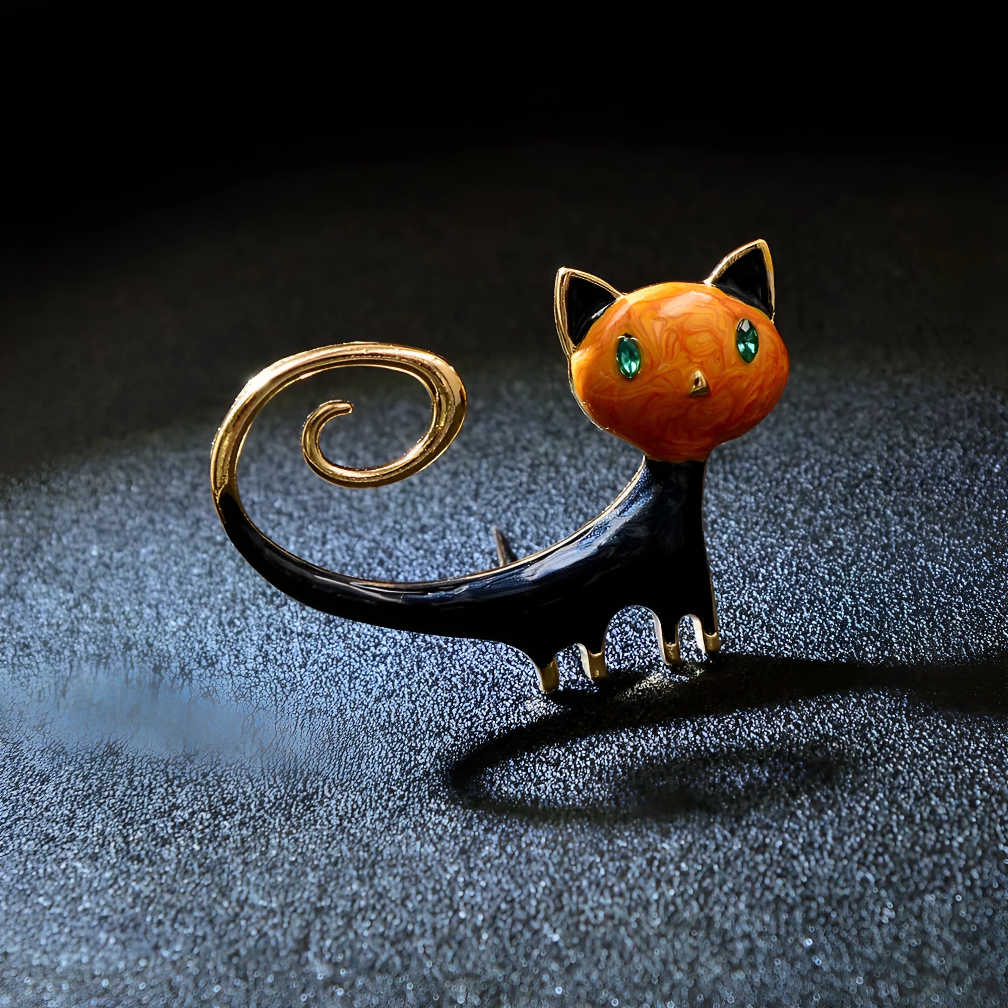 Orange and white alloy brooch with painted design of a cat with its tail up.