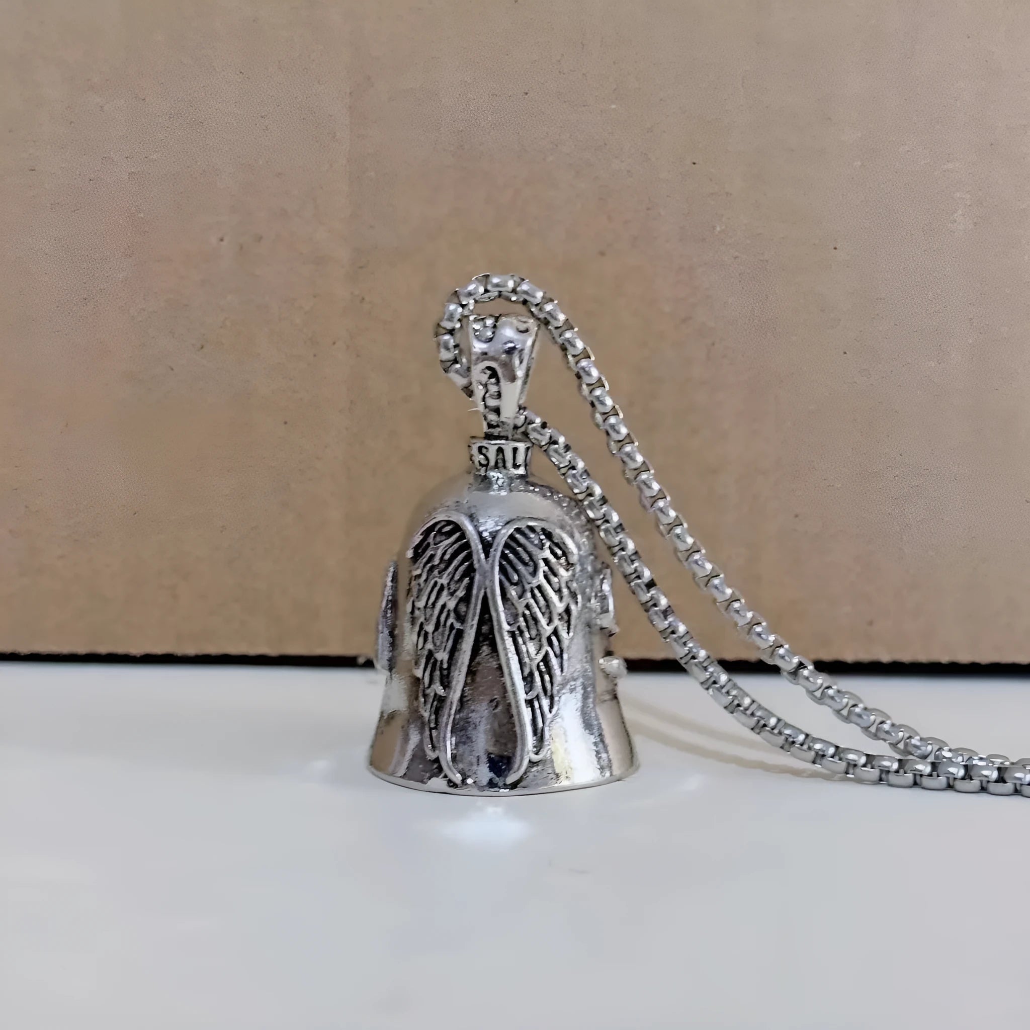 Silver-tone vintage angel feather and wings design necklace pendant and matching keychain.