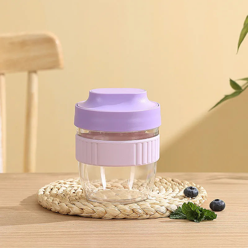 Green plastic salad cup with clear lid and spoon, sealed leak-proof design.