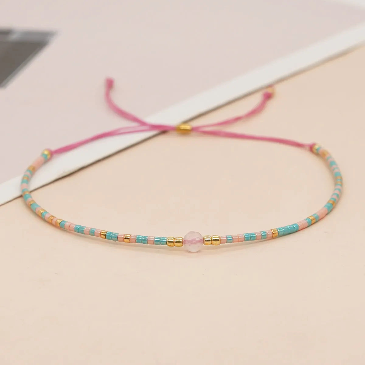 Women's handmade bohemian bracelet with semi-precious stone bead and colourful glass beads.