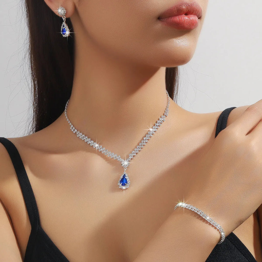 Claw chain rhinestone jewellery set with drop-shaped stones in multiple colour options