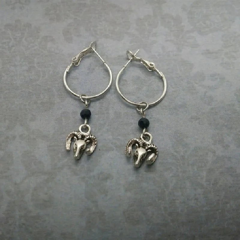 A pair of silver round hoop earrings for women with Tibetan antelope and Western style influences.