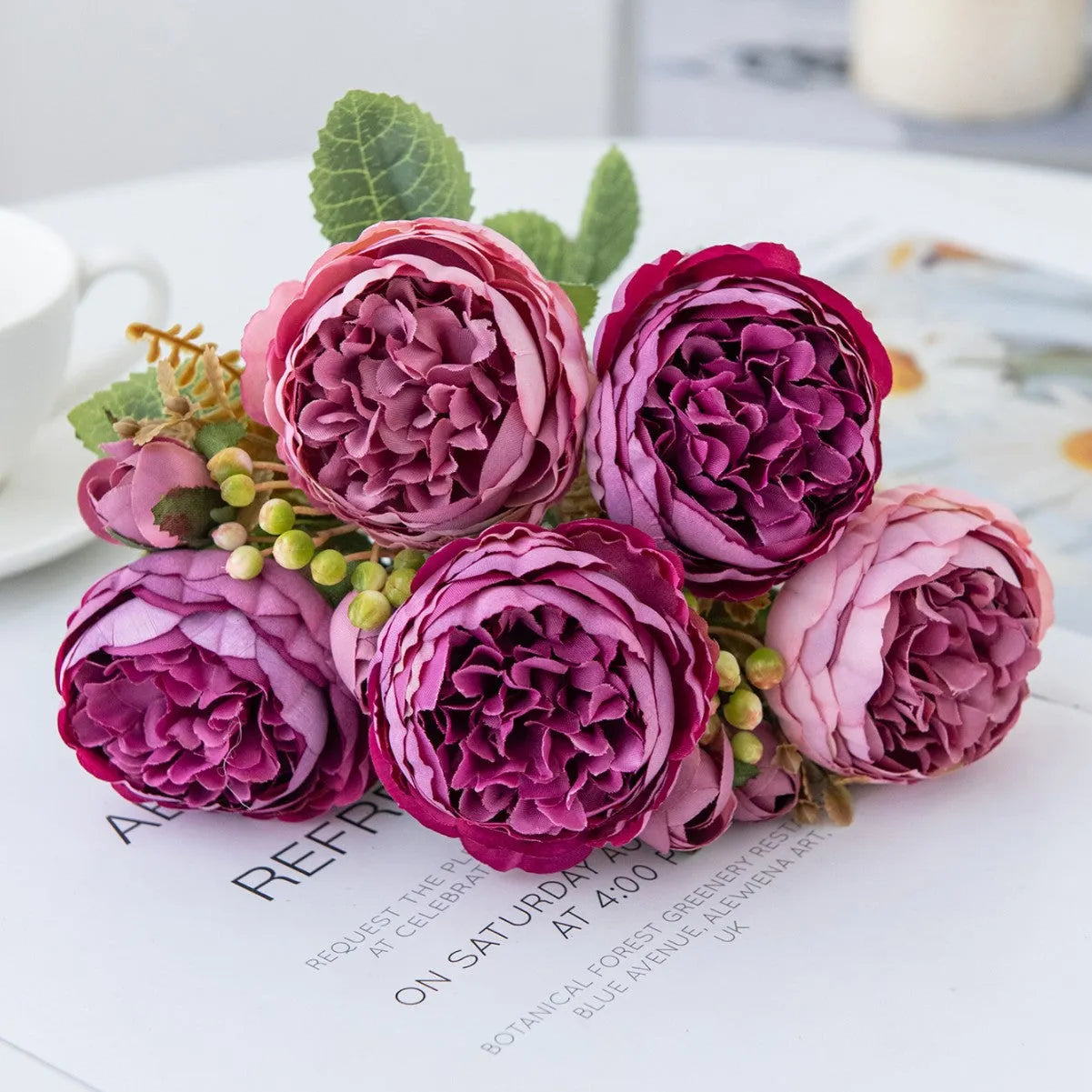 Artificial silk peony flower bouquet in a vase for home or wedding decoration