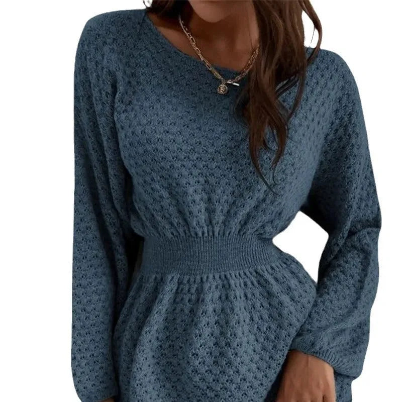 Blue women's knitted dress with hand-crocheted flowers, fitted waist, and loose round neck.
