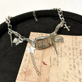 Dark multi-layer cross necklace with twin chains and hemp flowers detailing, adjustable 41-50cm length