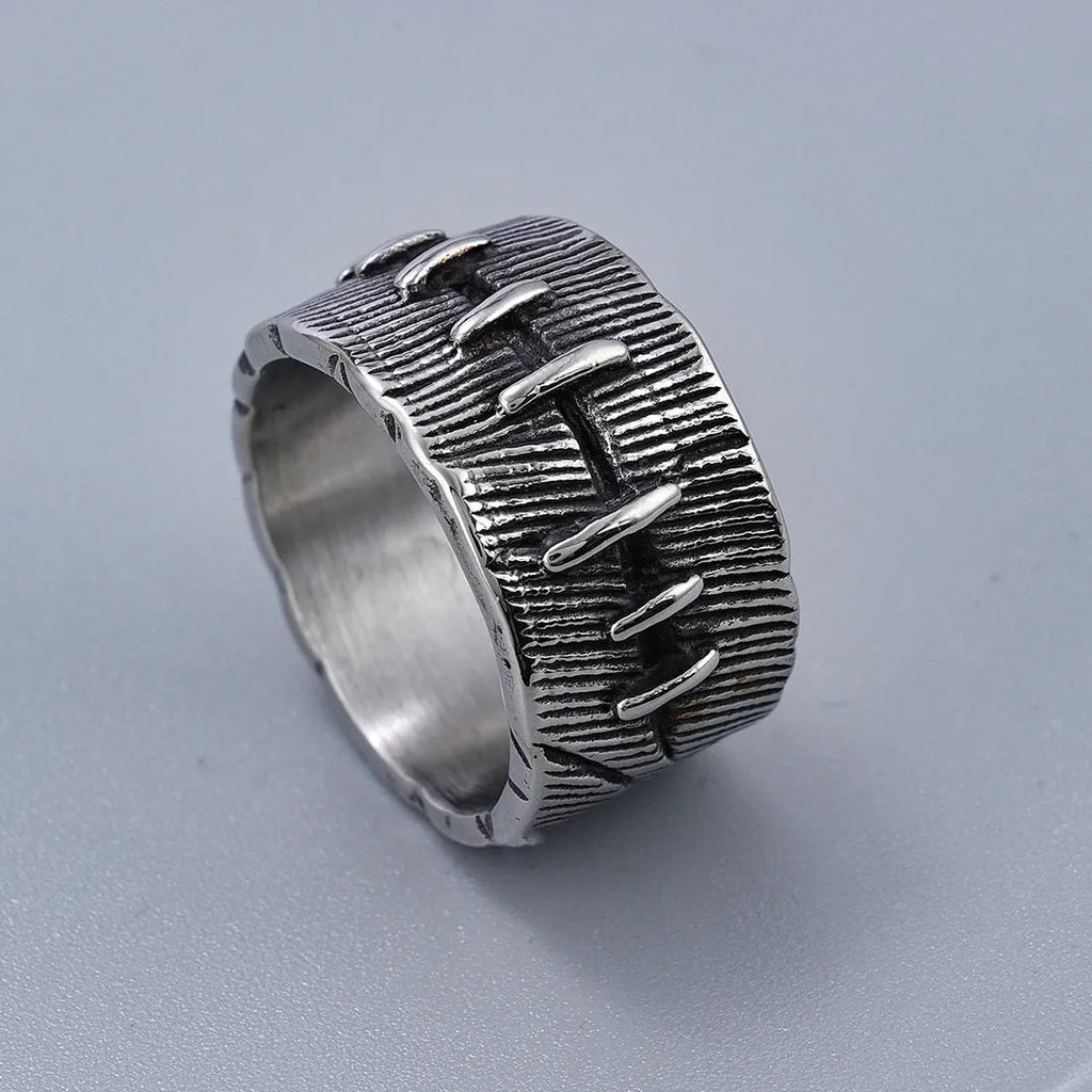 Dark punk geometric U-shaped double ring in titanium steel on a solid background