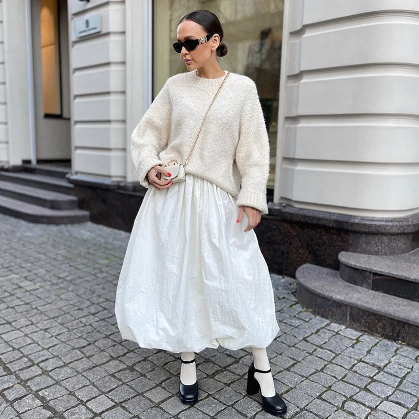 Women's long solid colour cotton skirt on a hanger, showing elasticated waist.