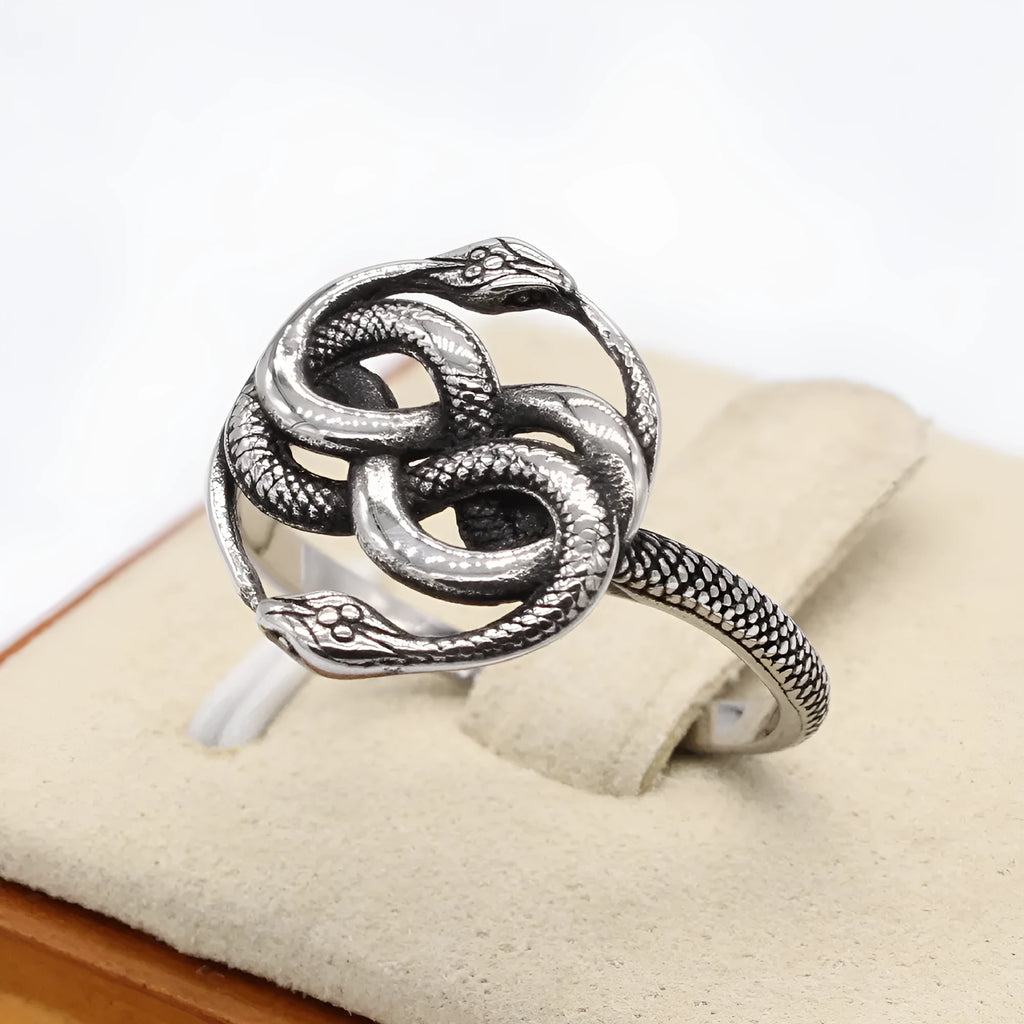 Close-up of a retro-style double snake ring made from titanium steel in a steel colour finish.