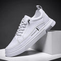 Men's low-top skateboard shoes with elastic band in white or black colour with stitching details