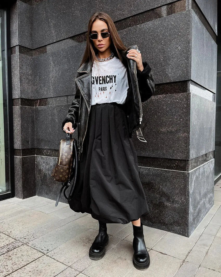 Women's long solid colour cotton skirt on a hanger, showing elasticated waist.