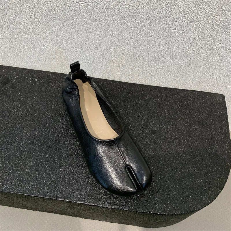 Women's apricot low chunky heel pumps with split toe and horseshoe peas detail on round toe.