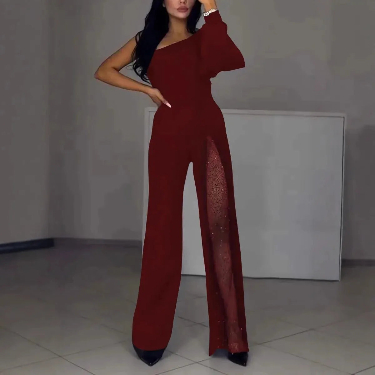 Women's black oblique shoulder jumpsuit with high slit design and long sleeves