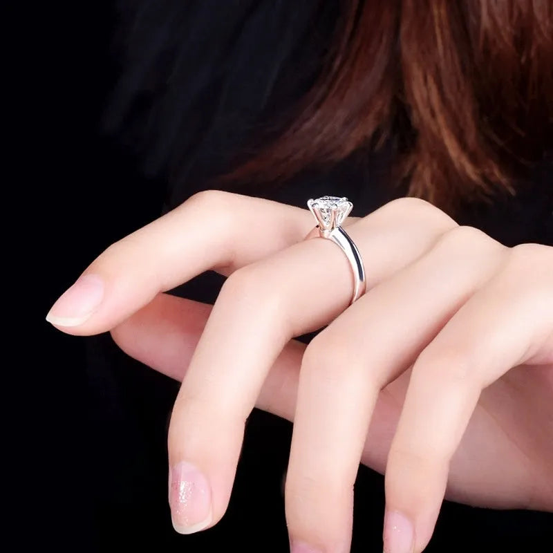 White gold plated women's ring with a geometric zircon stone in a six-claw setting.