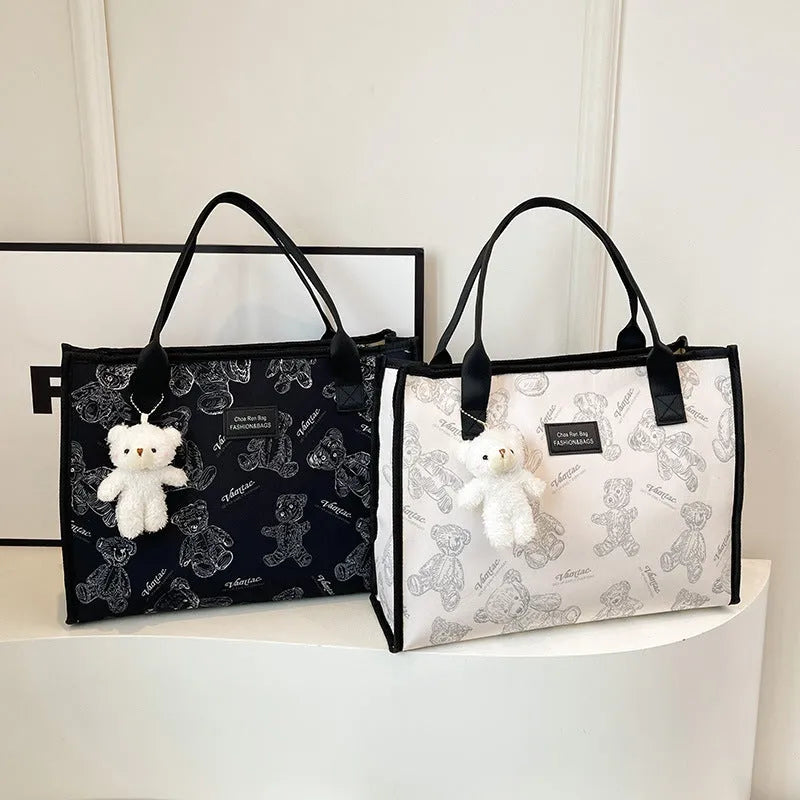 Women's black and white canvas tote bag with rhombus pattern and horizontal square shape