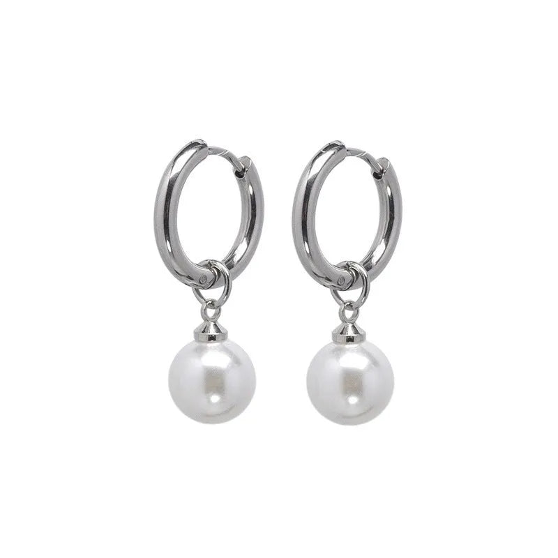 A pair of women's geometric pearl hoop earrings with alloy construction and titanium steel posts.