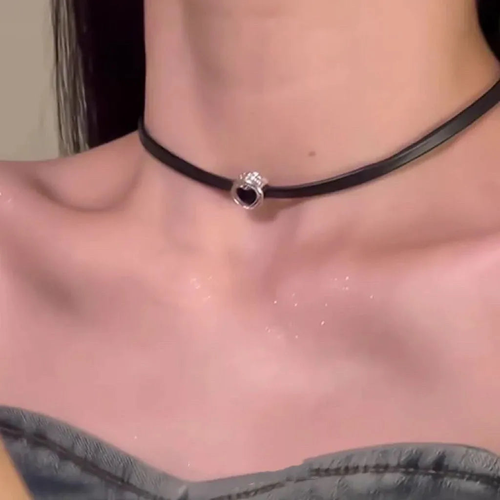 Women's twin necklace set showing double-layer leather heart and single-layer love designs with alloy and crystal elements
