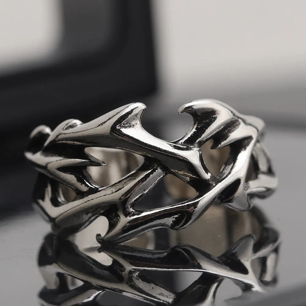 Copper geometric ring with thorn and flower design featuring adjustable opening mechanism