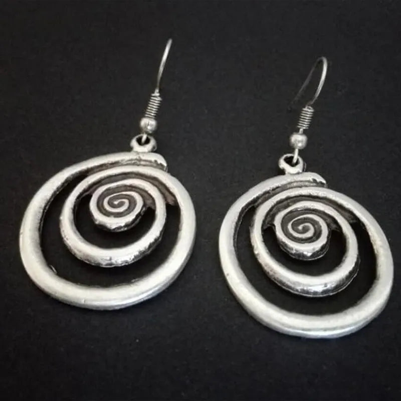 Geometric spiral earrings with distressed silver finish and retro design
